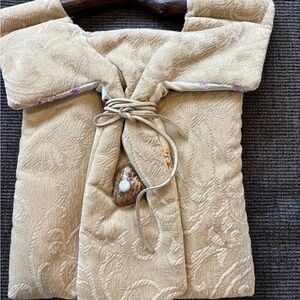 Beautiful purse hand made with silk lining and wooden handle.